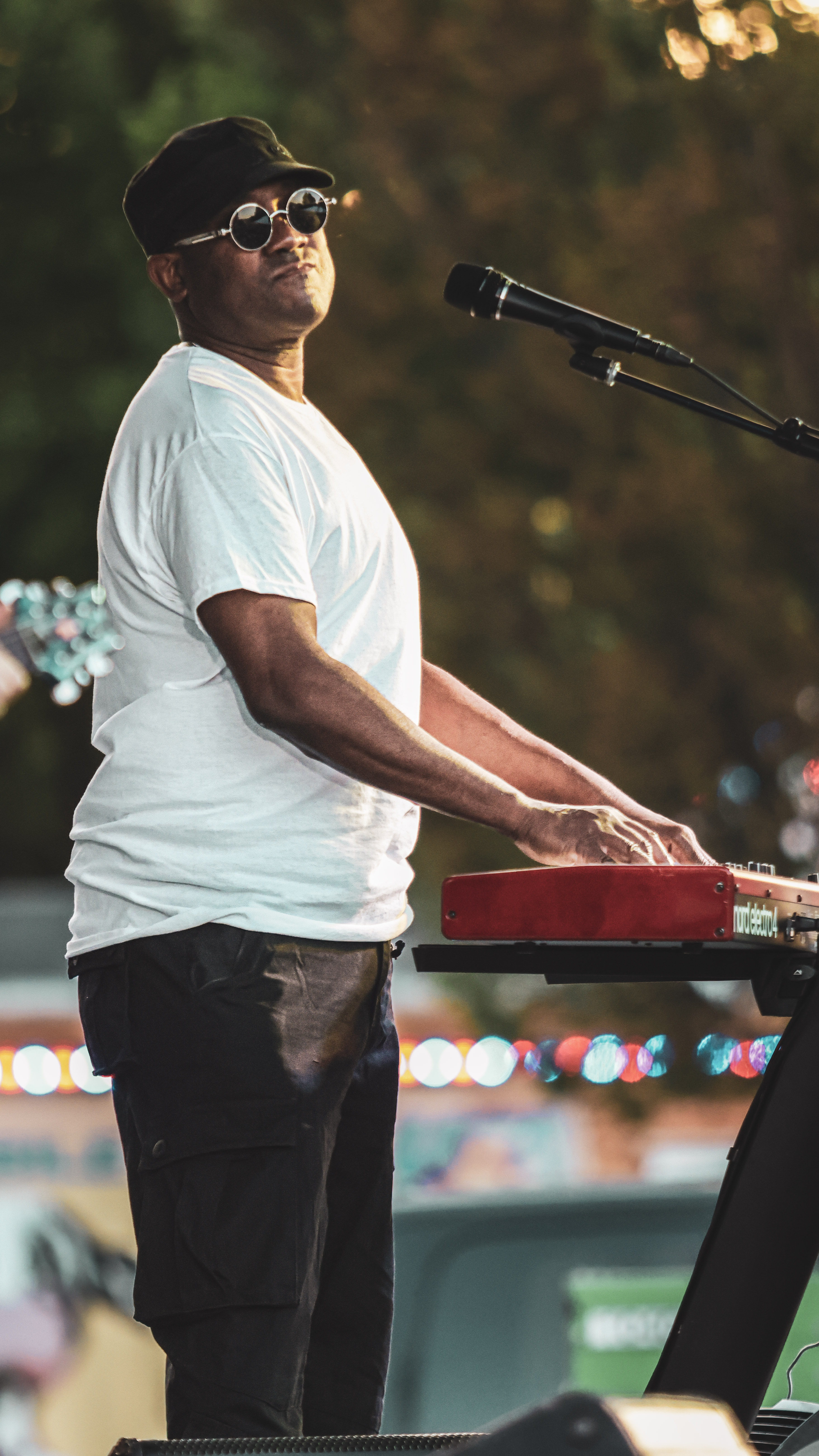 A keyboardist shares a moment with the audience during a live set.